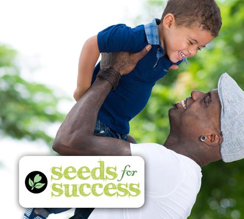 Photo of father and son with Seeds for Success logo 