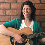 Meghan Feeman holds a guitar 