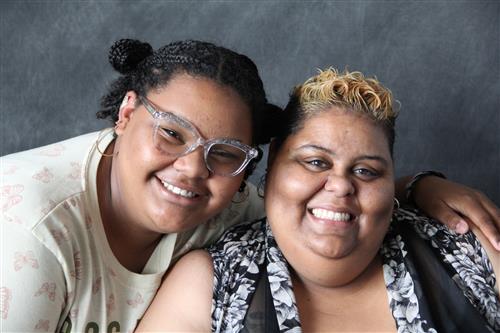 Mother and daughter smiling together
