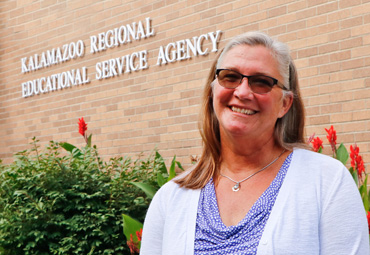  Joan Hawxhurst smiling in front of KRESA Service Center 