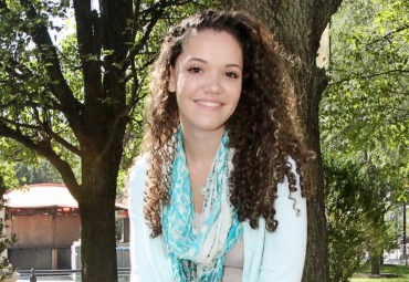  Lily Hall poses for a picture in the park